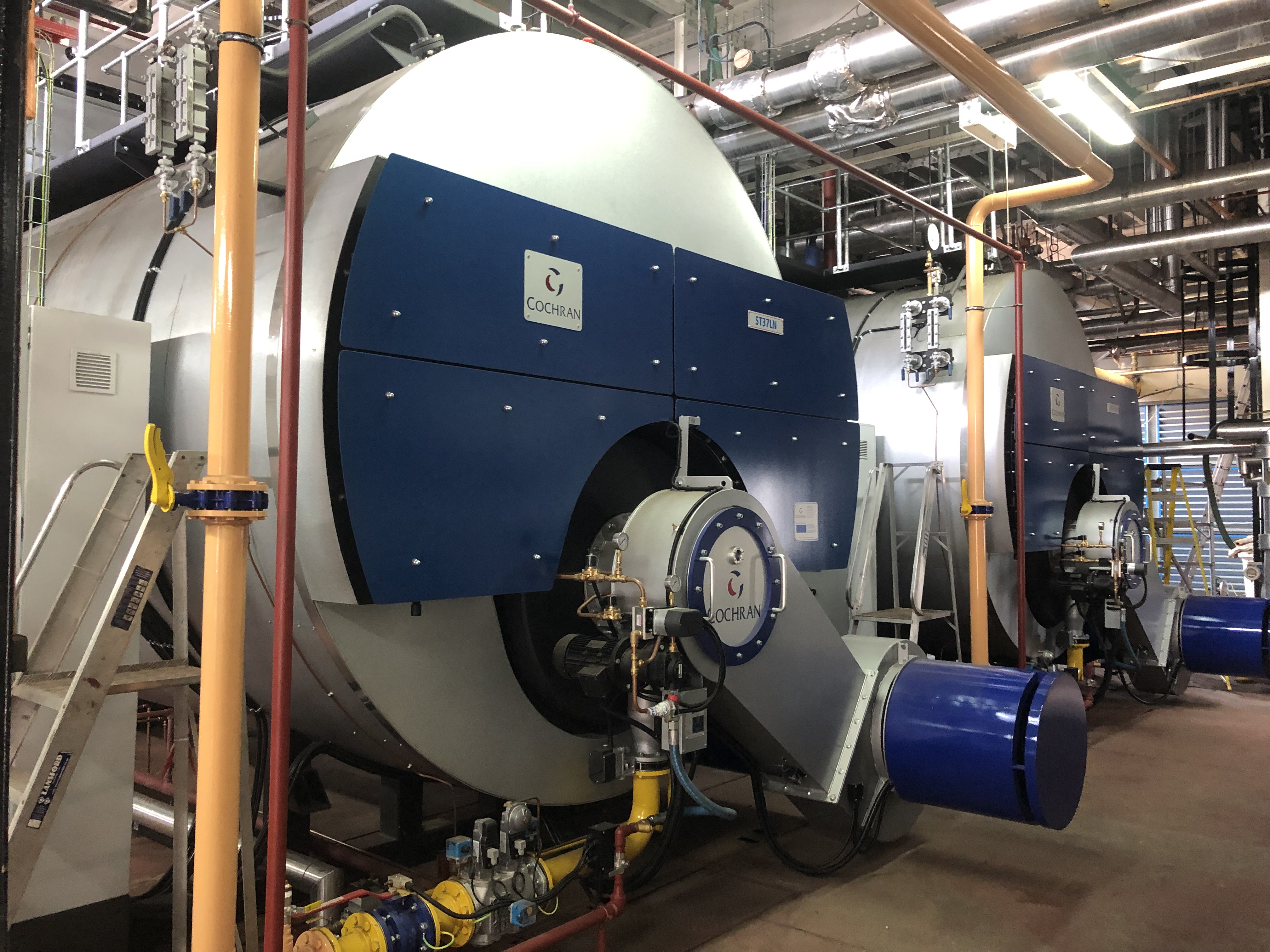 Cochran industrial steam boilers and associated pipework in a boilerhouse